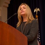 Woman speaks at event